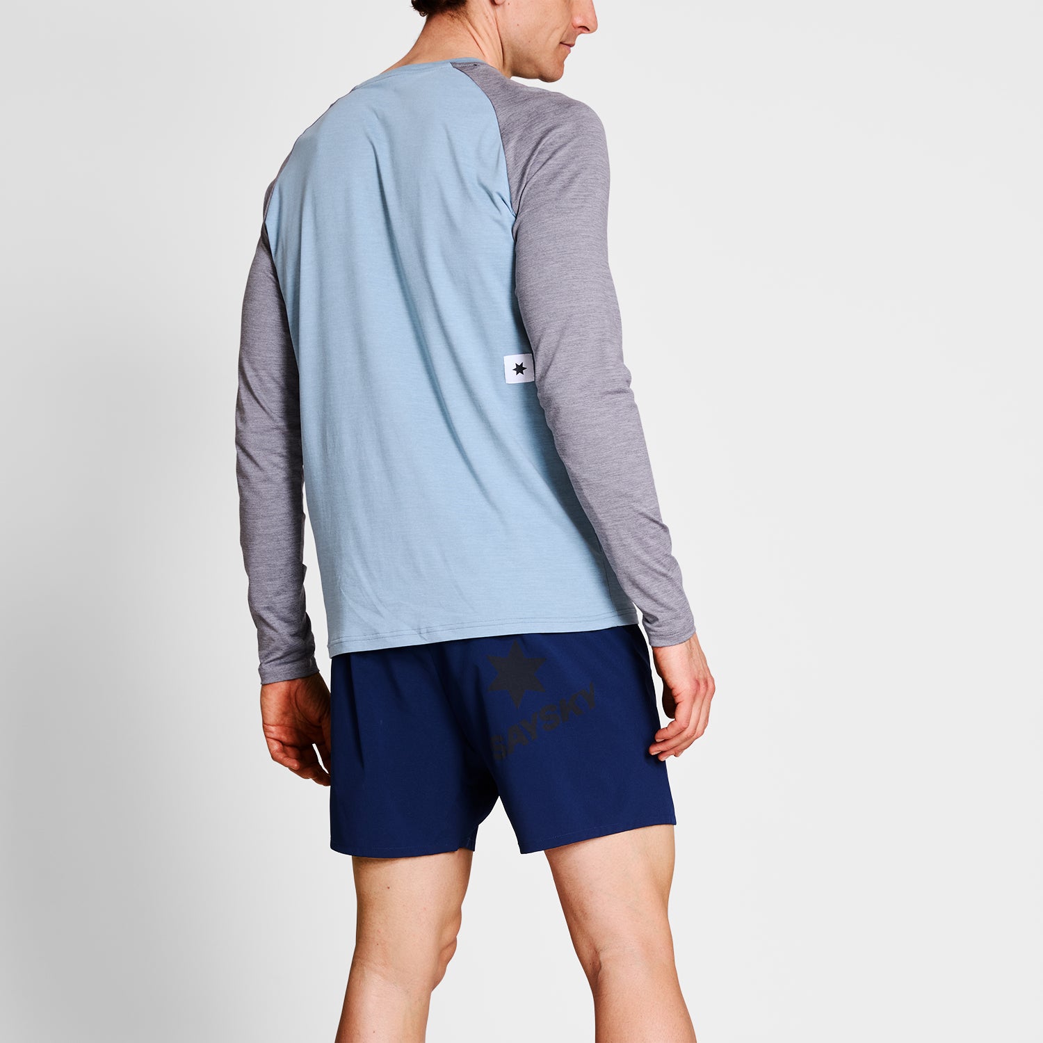 ランニングTシャツ（ロングスリーブ） NMRLS21c2010 Logo Pace Long Sleeve - Blue Melange [メンズ]