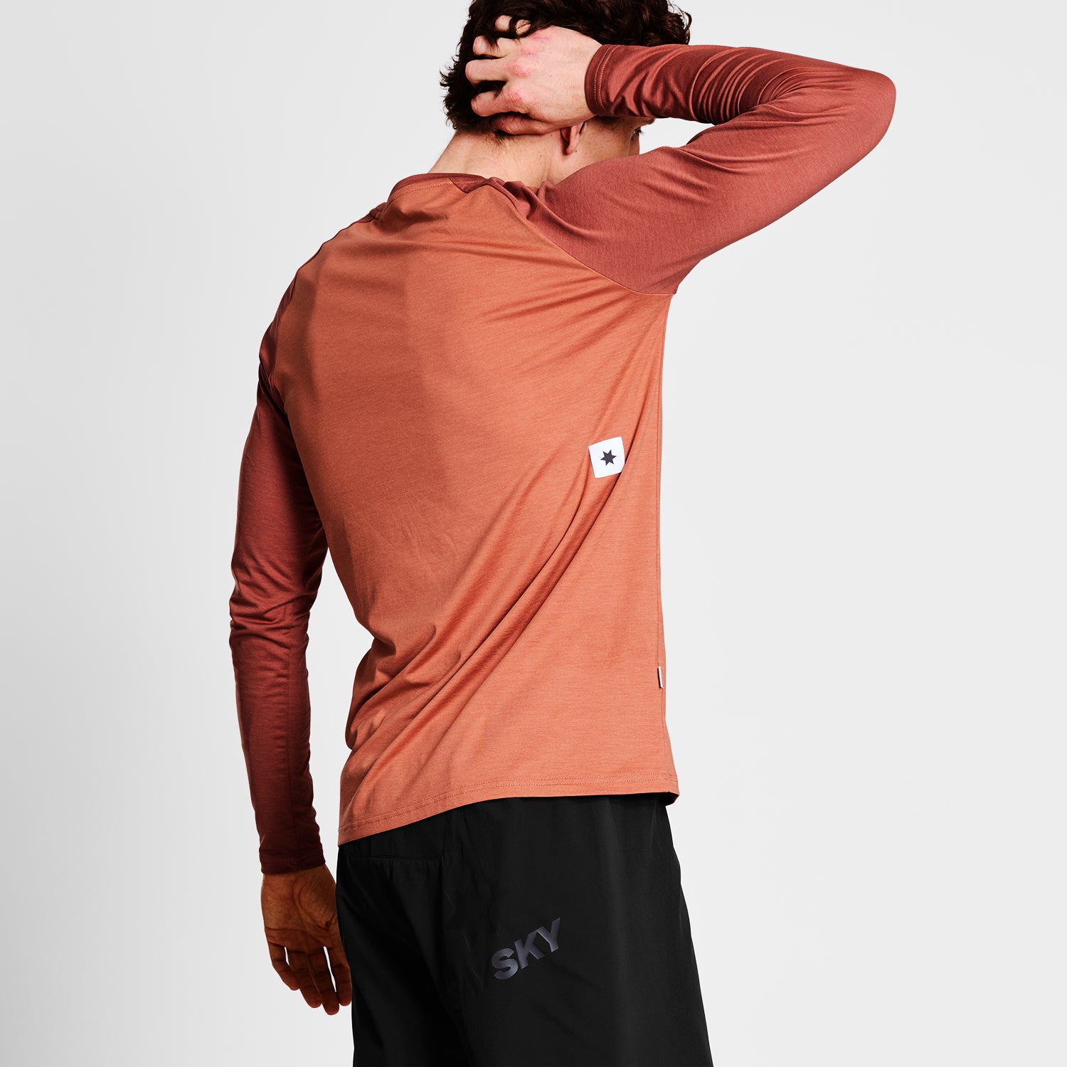 ランニングTシャツ（ロングスリーブ） NMRLS21c5005 Logo Pace Long Sleeve - Red Melange [メンズ]